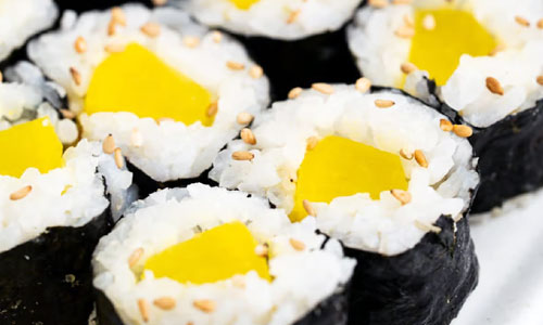 Sliced Oshinko sushi roll on a plate