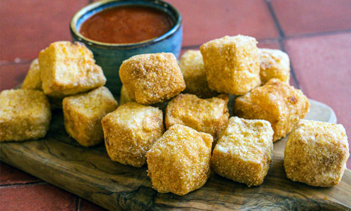 Plate of golden Crispy Tofu Bites